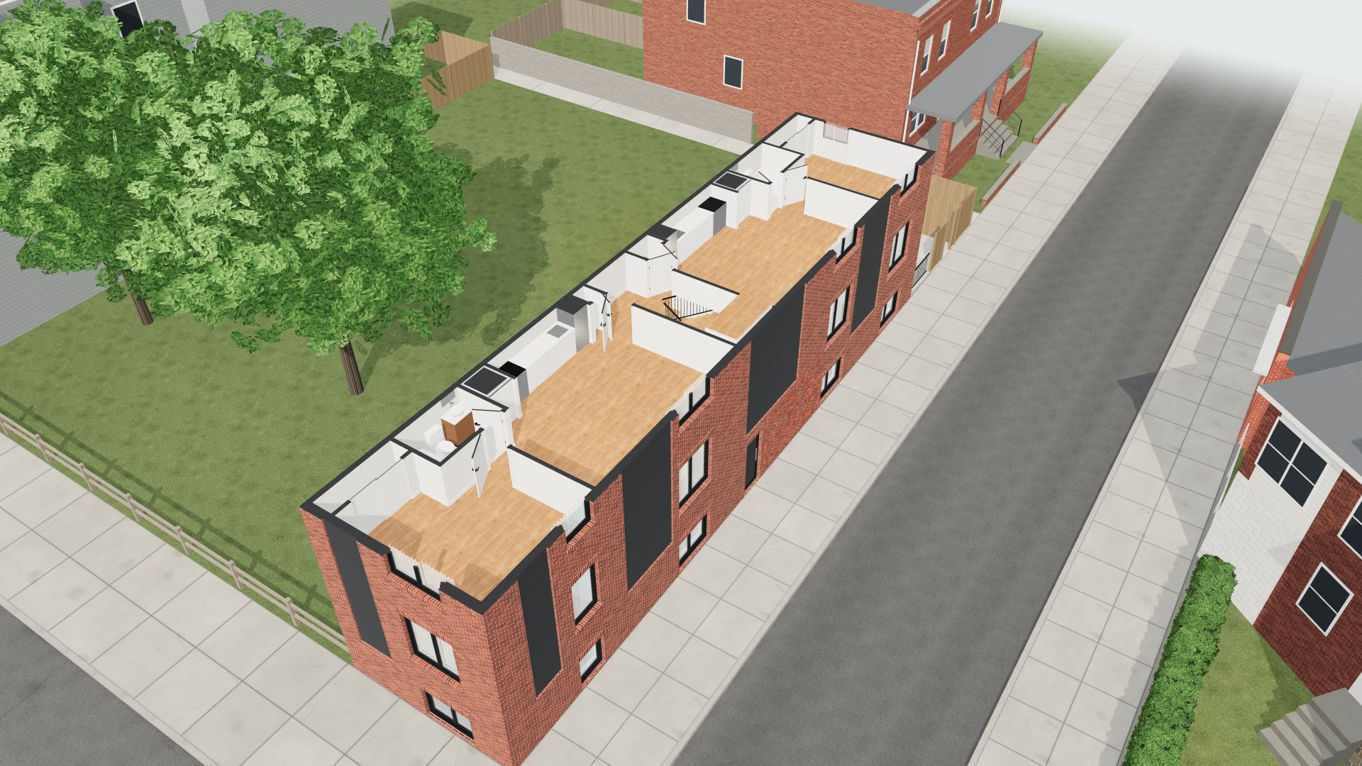 The corner building with its upper floors lifted off, showing two apartments from above